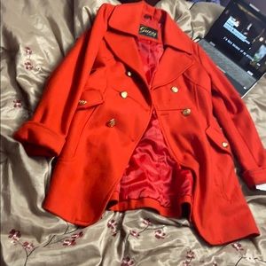 It is a pretty red coat.